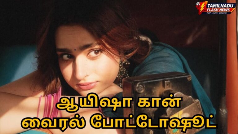 Actress Ayesha Khan posing in a deep blue saree with a pink sleeveless blouse during her latest photoshoot.