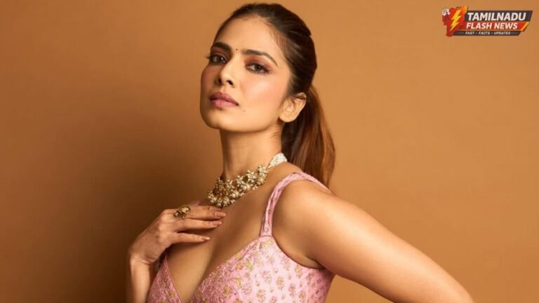 Malavika Mohanan posing in a vibrant ethnic wedding outfit for her latest social media update.