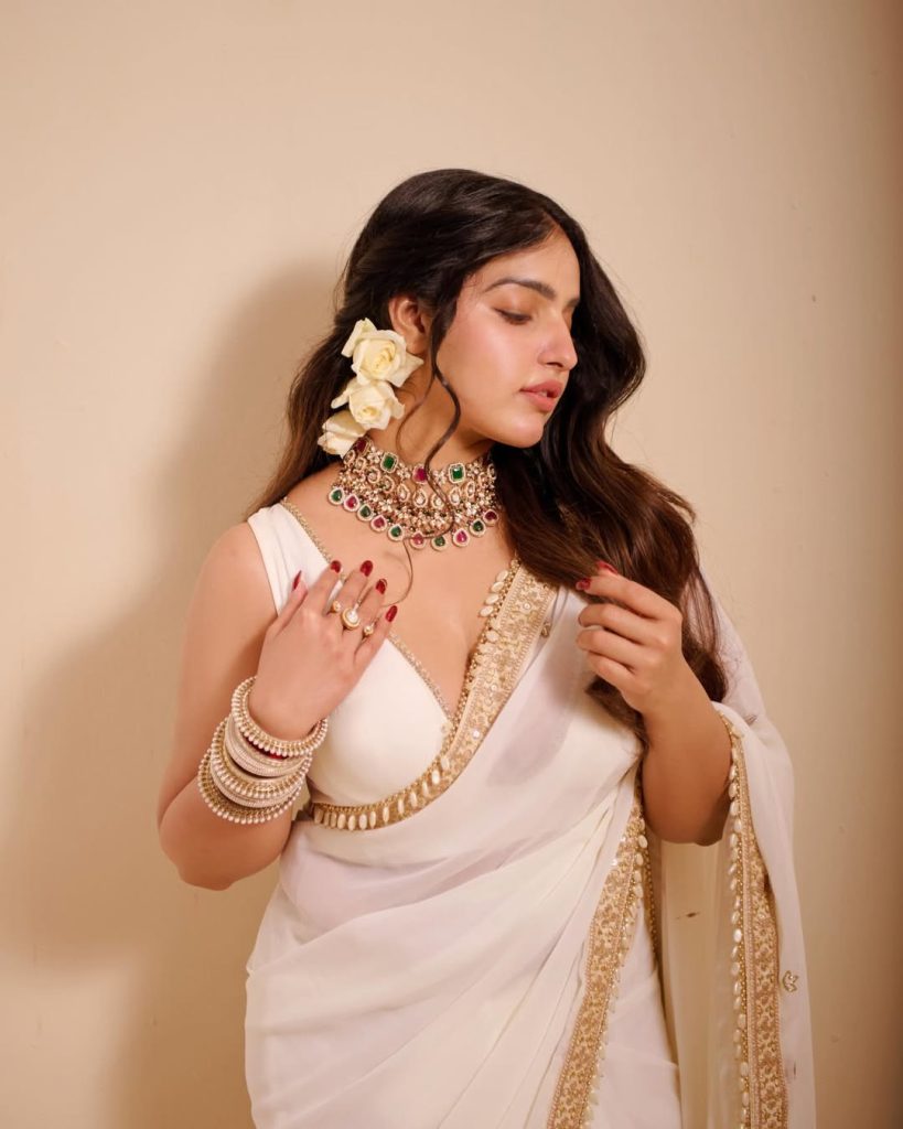 Official glamorous photoshoot of actress Malavika Menon in vibrant ethnic attire for 2026.