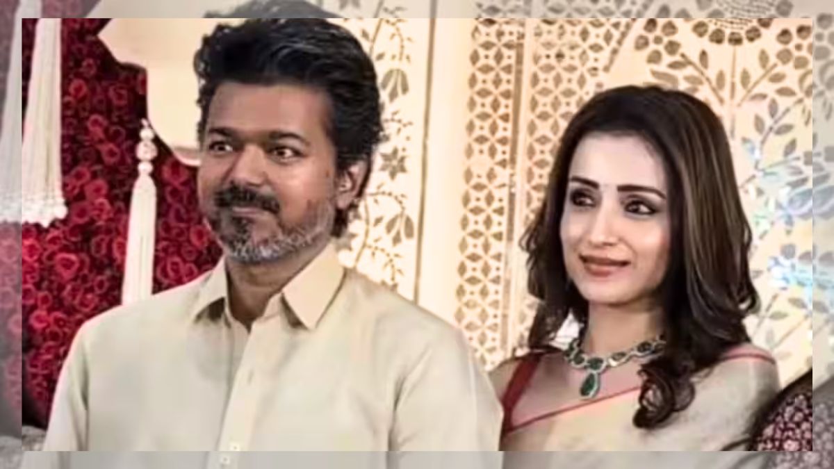 Vijay and Trisha Krishnan entering the wedding reception venue together in Chennai.