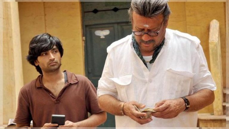 Official poster of Thiagarajan Kumararaja's cult classic movie Aaranya Kaandam featuring Jackie Shroff and Ravi Krishna.