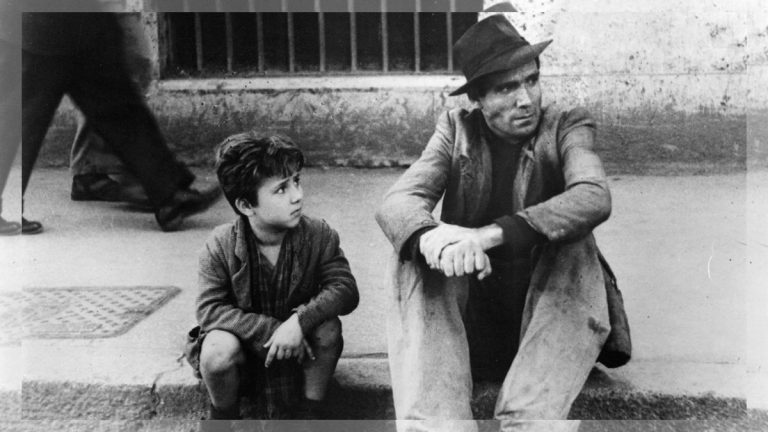 A classic scene from the movie Bicycle Thieves showing Antonio and his son Bruno searching for their bicycle in Rome.