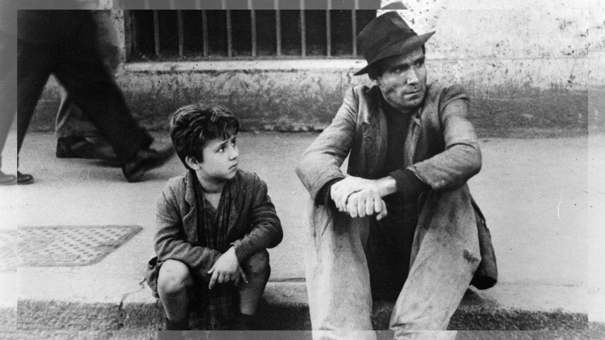 A classic scene from the movie Bicycle Thieves showing Antonio and his son Bruno searching for their bicycle in Rome.