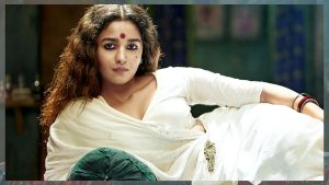 Actress Alia Bhatt as Gangubai Kathiawadi in her iconic white saree pose from the movie.
