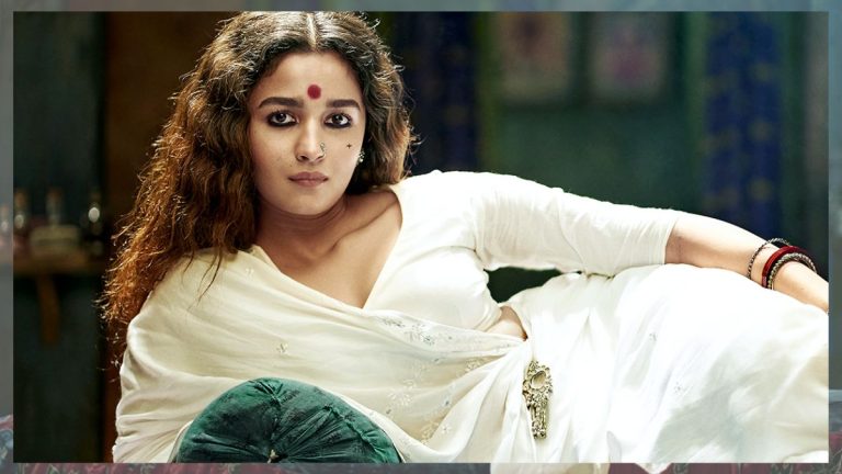 Actress Alia Bhatt as Gangubai Kathiawadi in her iconic white saree pose from the movie.