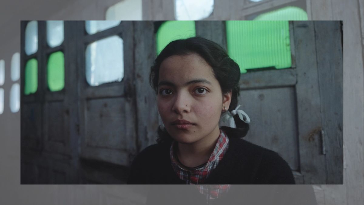 Cinematic still from the short film Gods Do Not Follow featuring protagonist Uma in the Kullu Valley landscape.