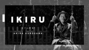 Kanji Watanabe sitting on a swing in the snow from Akira Kurosawa's film Ikiru.