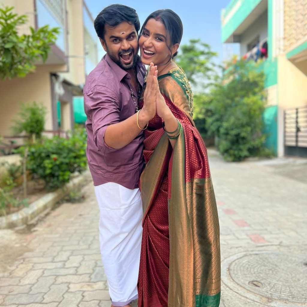 Tamil television actors Reshma Muralidharan and Madhan Pandian posing together for an official media event.