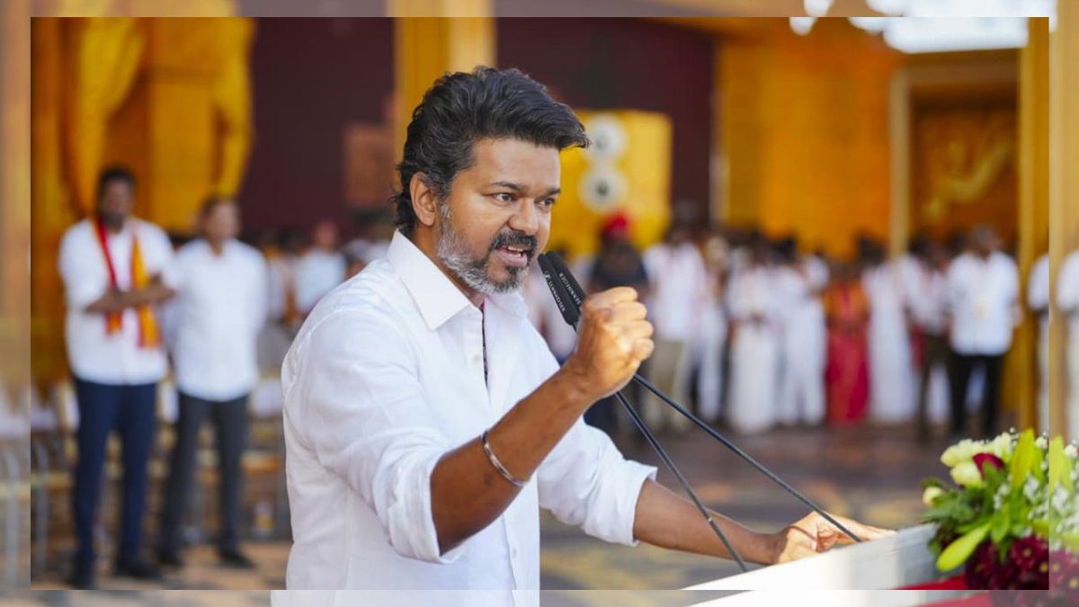 TVK President Vijay surrounded by supporters during 2026 Tamil Nadu assembly election campaign in Chennai.