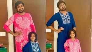 Actor Sathish smiling with his young daughter Niharika in a casual home setting
