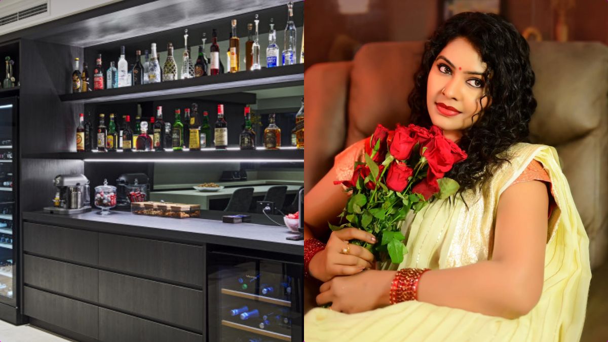 Actress Rachitha Mahalakshmi standing in the private bar area of her house.