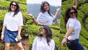 Actress Rachitha Mahalakshmi posing gracefully in a lush green tea estate during her vacation.