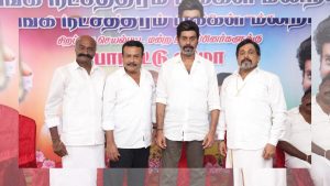 Actor Natty Natraj in a white shirt and salt-and-pepper look from TN 2026 political movie.