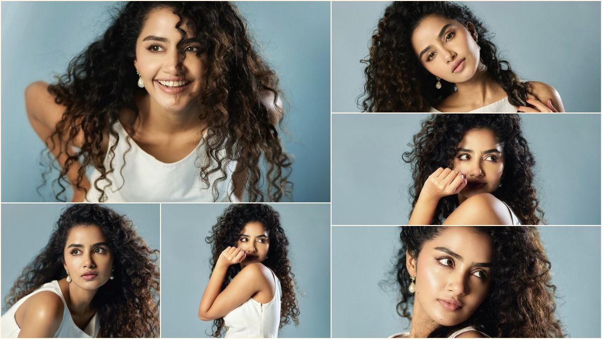Actress Anupama Parameswaran showcasing two side plaits hairstyle and singing a melody song in front of a mirror.