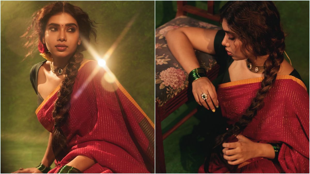South Indian actress Dushara Vijayan posing gracefully in an elegant red color saree paired with a stylish black blouse for her latest Instagram photoshoot.
