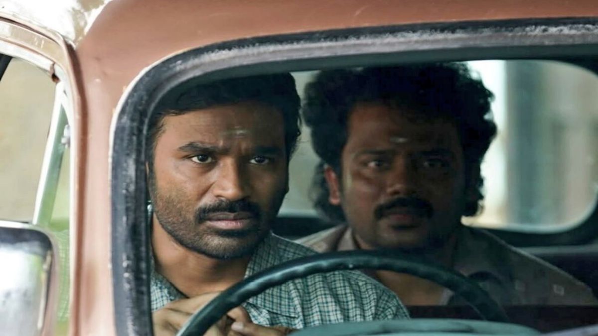 An intense still of actor Dhanush as Karasaami from the rural heist thriller Kara, showcasing his powerful screen presence.
