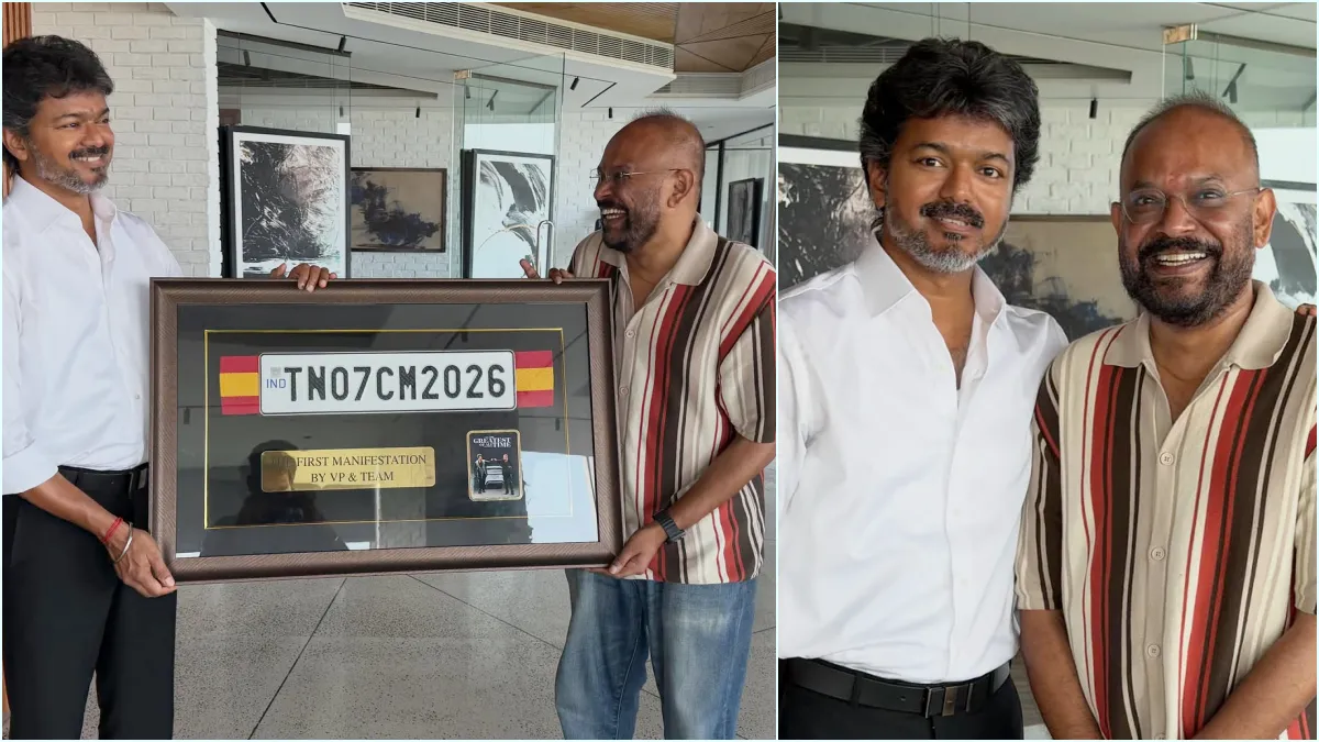 Director Venkat Prabhu posing happily while presenting the official GOAT movie CM 2026 car number plate gift to Tamil Nadu Chief Minister Joseph Vijay.