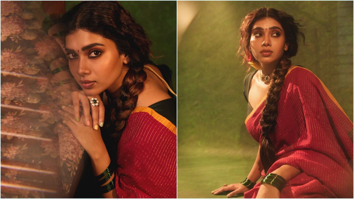 Red Saree Glamour! — "சிவப்பு புடவையில் சொக்க வைக்கும் மாரியம்மா!" — கருப்பு பிளவுஸ் காம்பினேஷனில் துஷாரா விஜயன் நடத்திய லேட்டஸ்ட் போட்டோஷூட்; கியூட் புகைப்படங்கள் வைரல்! 4 South Indian actress Dushara Vijayan captured beautifully in warm golden hour lighting, draped in a classy red traditional Indian outfit.