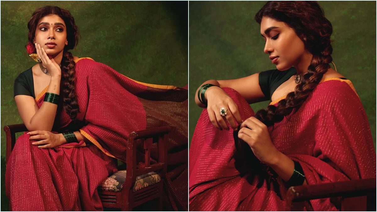 Red Saree Glamour! — "சிவப்பு புடவையில் சொக்க வைக்கும் மாரியம்மா!" — கருப்பு பிளவுஸ் காம்பினேஷனில் துஷாரா விஜயன் நடத்திய லேட்டஸ்ட் போட்டோஷூட்; கியூட் புகைப்படங்கள் வைரல்! 1 Actress Dushara Vijayan sporting a traditional look in a vibrant red georgette saree and a contrasts black blouse during her sunset photoshoot.