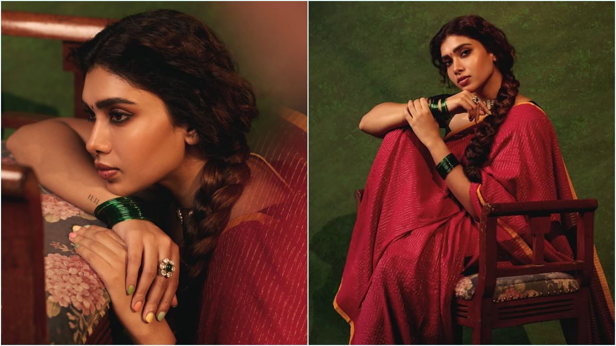 Red Saree Glamour! — "சிவப்பு புடவையில் சொக்க வைக்கும் மாரியம்மா!" — கருப்பு பிளவுஸ் காம்பினேஷனில் துஷாரா விஜயன் நடத்திய லேட்டஸ்ட் போட்டோஷூட்; கியூட் புகைப்படங்கள் வைரல்! 2 A stunning close-up portrait of Tamil actress Dushara Vijayan showing off her expressive eyes and minimal makeup profile in a red saree backdrop.