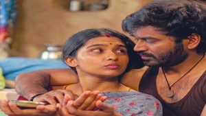 A movie review poster of Dhanush's Kara featuring key highlights like 'Intense Heist Thriller' and 'Terrific Performance'.