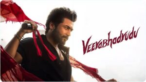 Tollywood Goes Crazy For Suriya! — "ஆந்திராவிலும் அசுர ஆட்டம்!" — சூர்யாவின் 'வீரபத்ருடு' படத்திற்கு திரண்ட பாசிட்டிவ் விமர்சனங்கள்; வாழ்த்தி தள்ளிய நாக சைதன்யா & விஜய் தேவரகொண்டா! The official Telugu movie poster of actor Suriya's action film Veerabhadrudu, distributed by Annapurna Studios in Andhra Pradesh and Telangana.