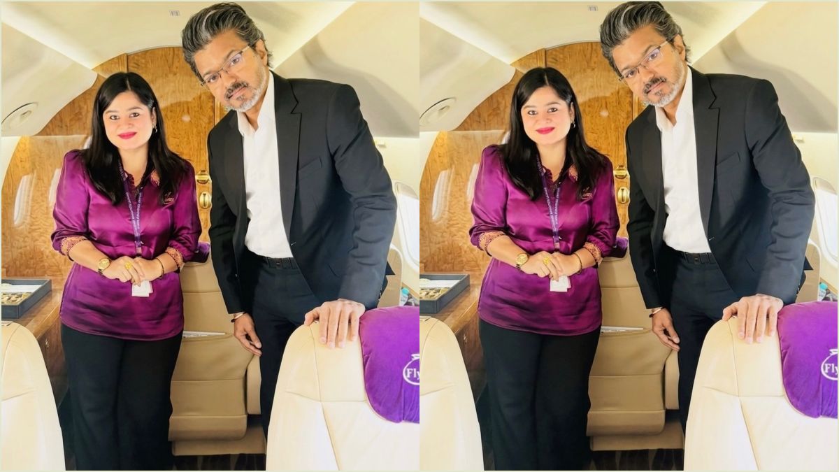 Tamil Nadu Chief Minister C Joseph Vijay posing for a photo with airhostess Meenakshi Uma during flight travel.